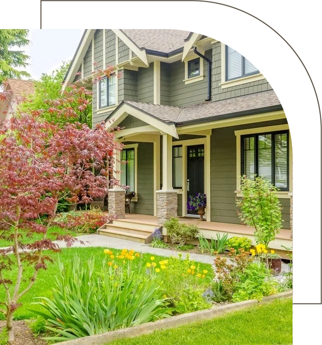 A house with many flowers in the yard